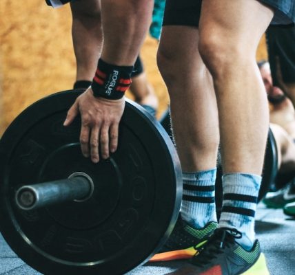 person about to lift the weight plate