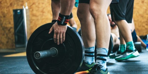 person about to lift the weight plate